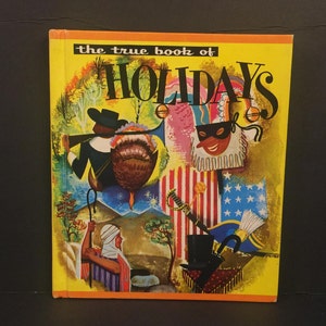 May include: The cover of a vintage book titled "The True Book of Holidays". The cover features a colorful illustration of people celebrating different holidays, including a pilgrim with a turkey, a jester with a mask, and a person holding a flag.