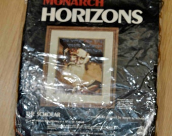 May include: A black and white cross-stitch kit featuring a portrait of a man with a beard and a book. The kit is titled "The Scholar" and is from the Monarch Horizons brand.