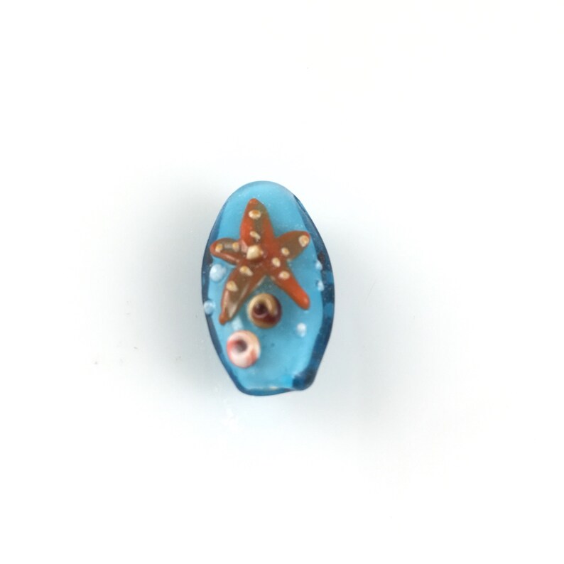 One Oval Lampwork glass 25mmx15mmx10mm blue orange starfish blue orange