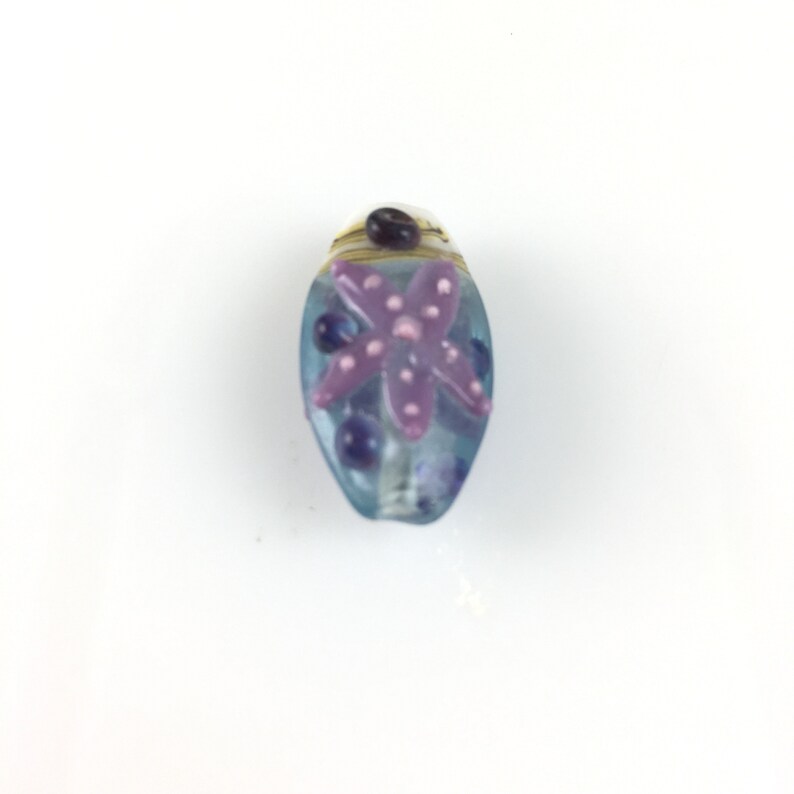 One Oval Lampwork glass 25mmx15mmx10mm blue orange starfish purple starfish