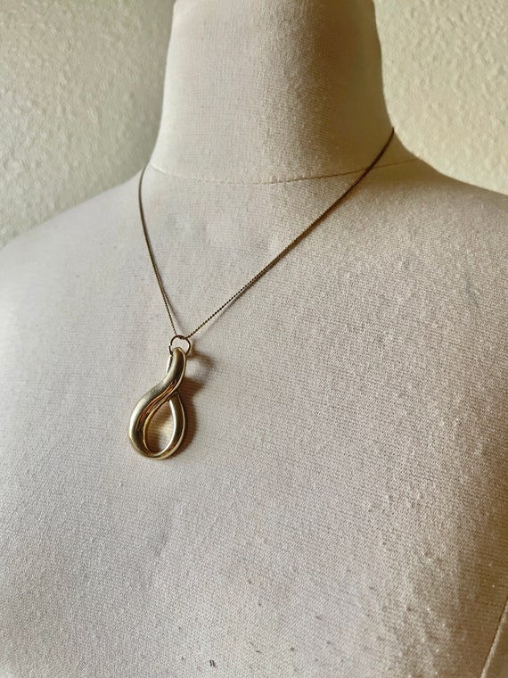 Vintage large infinity pendant on dainty gold chai