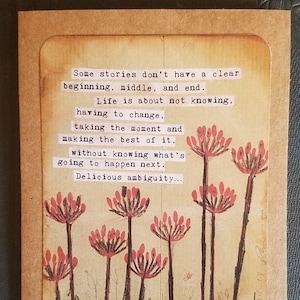 May include: A vintage-style card with a quote about life and change. The quote reads: "Some stories don't have a clear beginning, middle, and end. Life is about not knowing, having to change, taking the moment and making the best of it, without knowing what's going to happen next. Delicious ambiguity..." - Gilda Radner. The card features a drawing of pink flowers with long stems.