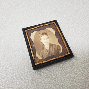 Antique Daguerreotype of a Young Women Mid 19th Century in Leather Embossed Case Frame