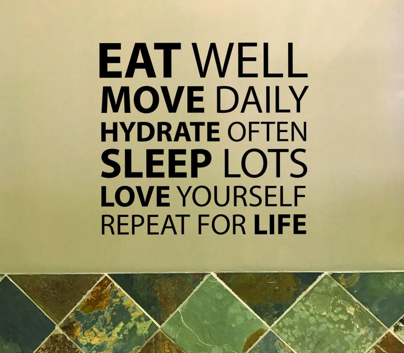 May include: A motivational quote on a beige wall with a tiled floor. The quote reads: "Eat well, move daily, hydrate often, sleep lots, love yourself, repeat for life."