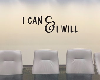 May include: A motivational quote, "I CAN & I WILL", is displayed on a beige wall above a row of five grey office chairs.
