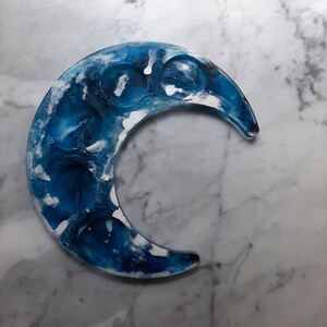 Crescent moon candle holder