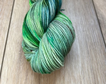 Autumn’s first breath: green with brown speckles superwash merino/nylon fingering weight 4ply sock yarn, high twist OOAK 100g skein