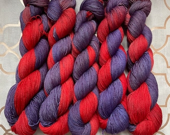 Sagittarius: Fingering weight 4ply sw merino sock yarn hand dyed in shades of red and purple, garnet and amethyst inspired, zodiac theme