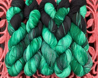 Scorpio: Fingering weight 4ply sw merino sock yarn hand dyed in shades of green and black, malachite and obsidian inspired, zodiac theme