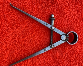 4 inch inside calipers. 4 1/2 inch legs with spring top. Made by Star and Co New York, USA Circa 1960