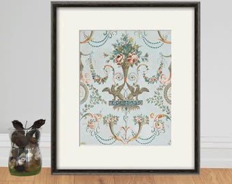 May include: A framed print of a vintage wallpaper design featuring a floral motif with a central vase of flowers and two birds flanking the vase. The wallpaper is in shades of green, pink, and blue on a light blue background.