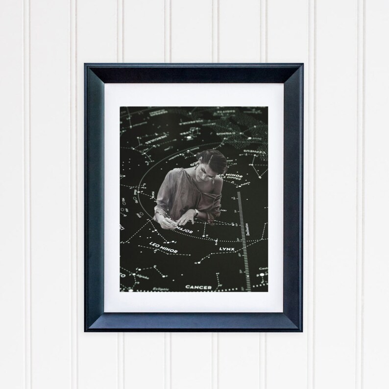 May include: A black and white photo of a person studying a star chart. The chart shows the constellations of Leo Minor, Cancer, Lynx, and Ursa Major. The person is wearing a light-colored shirt and is looking down at the chart.