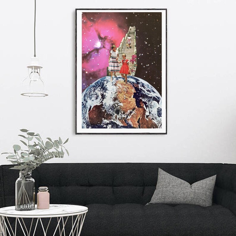 May include: A framed collage art print featuring a pink and purple nebula with a staircase leading up to a woman and a child standing on a globe. The globe is a representation of Earth.