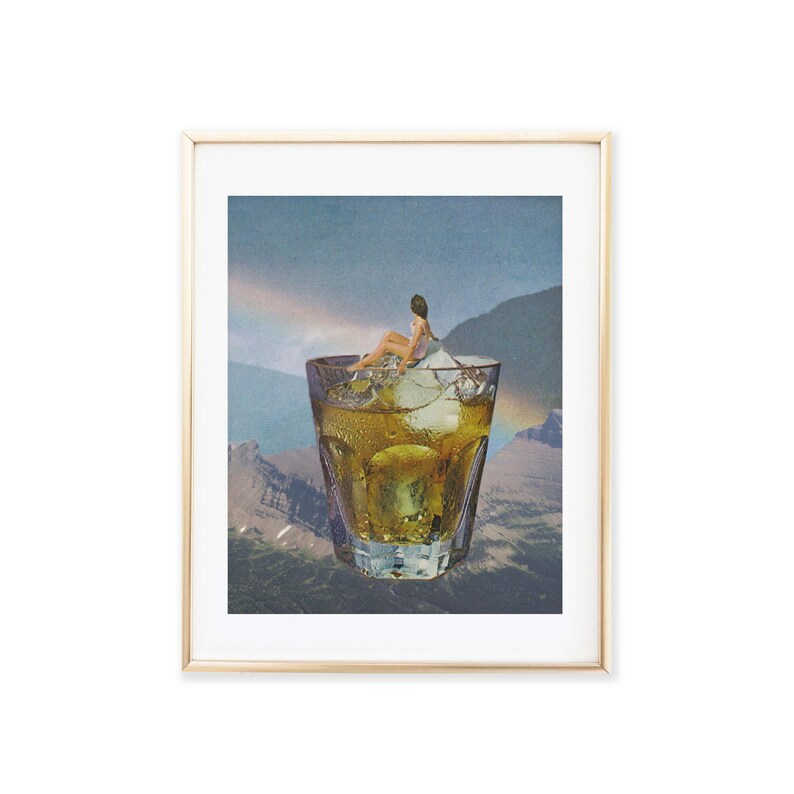 May include: A collage artwork featuring a woman sitting on a piece of ice in a glass of amber liquid. The glass is surrounded by a mountain landscape with a rainbow in the background.