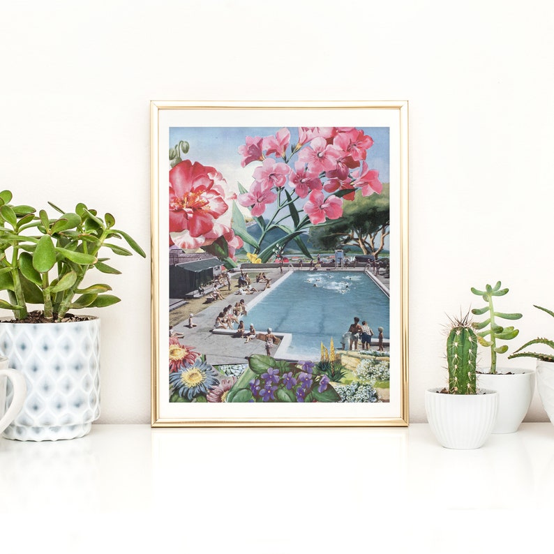 May include: A framed collage print featuring a swimming pool with people in it, surrounded by lush greenery and pink flowers. The print has a vintage aesthetic.