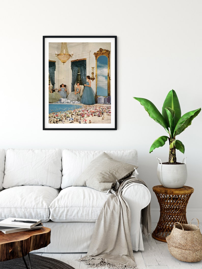 May include: A framed collage art print featuring three women in blue dresses standing in a room with a large mirror reflecting a beach scene with people.