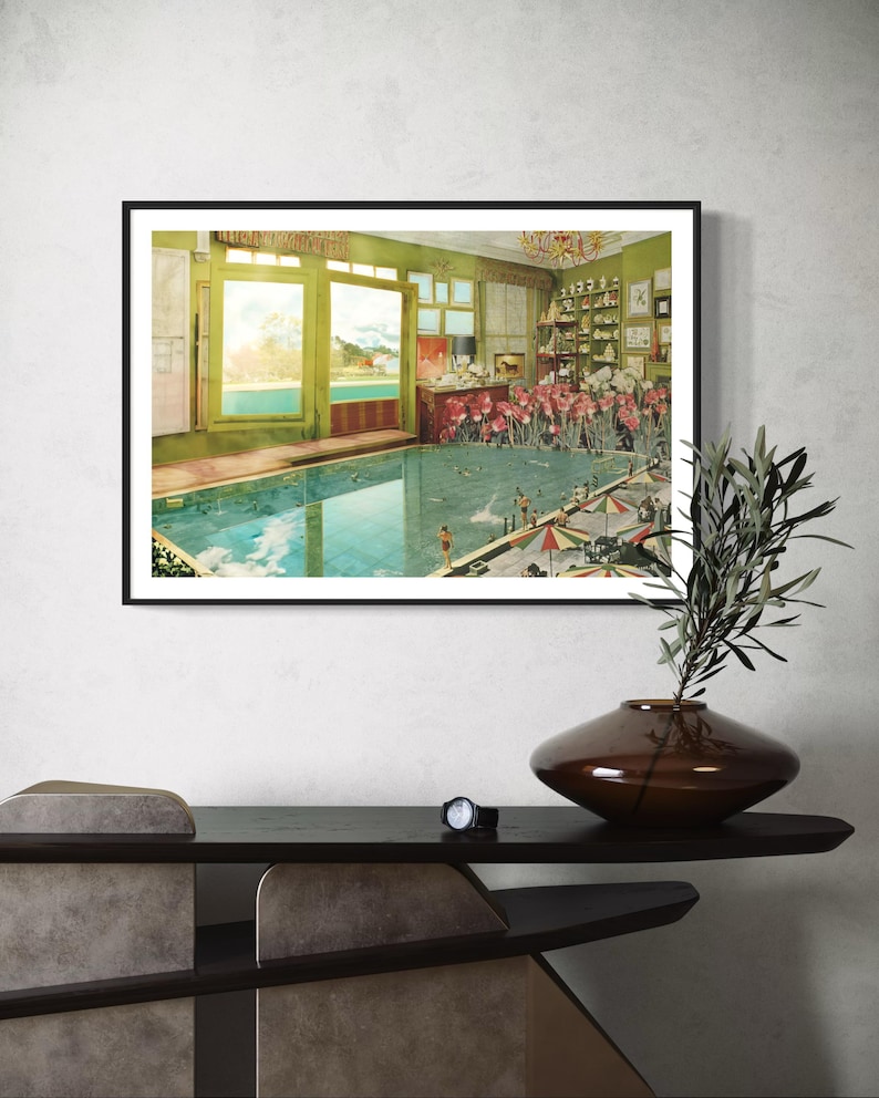 May include: A framed print of a surrealist collage depicting a swimming pool inside a room with an open window overlooking a lake. The pool is filled with water and has people swimming in it. There are also flowers and other objects in the room.