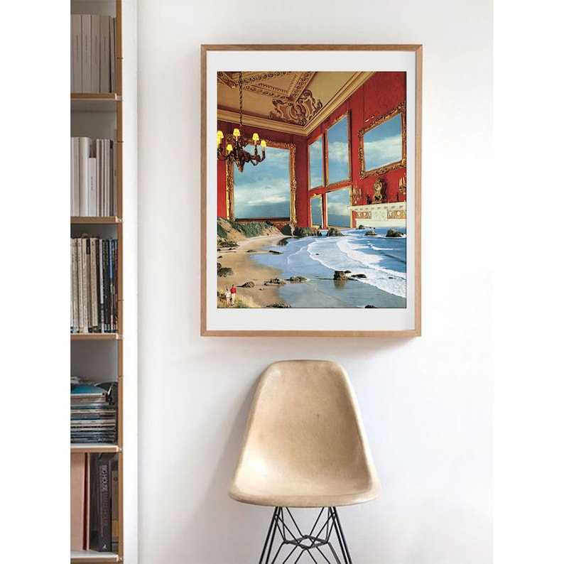 May include: A framed print of a surrealist collage depicting a red room with gold-framed windows that open onto a beach scene with crashing waves.