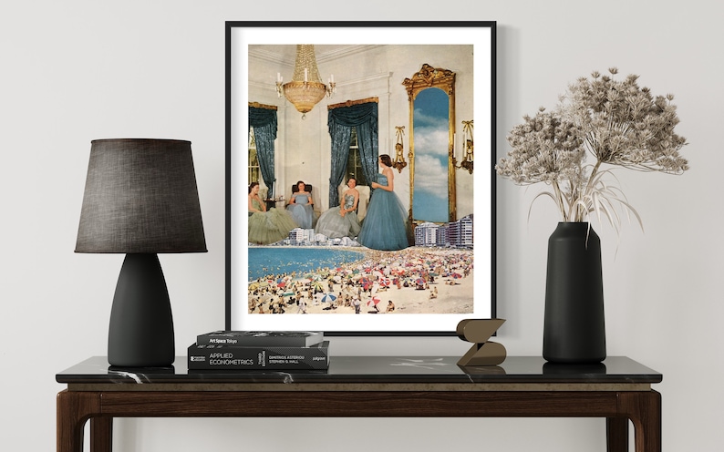 May include: A framed collage art print featuring four women in blue dresses standing in a room with a large mirror reflecting a beach scene with a crowd of people.