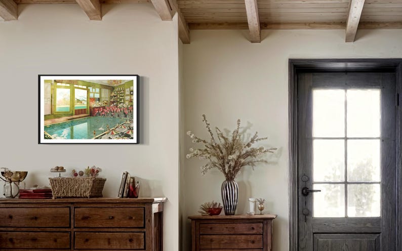 May include: A framed vintage postcard depicting a swimming pool with people in bathing suits. The pool is surrounded by a green tiled wall and there are windows on the side of the pool.
