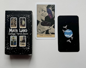 May include: A black box with the text "Maya Land Collage Tarot Deck" on the front. The box shows three tarot cards: The Empress, The Lovers, and The Moon. The cards are on a black background with white stars.