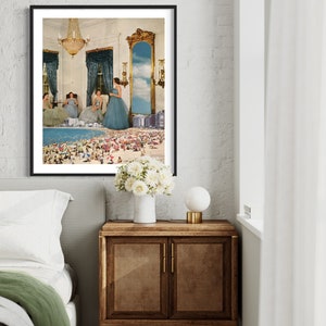 May include: A framed print of a surrealist collage featuring three women in blue dresses standing in a room with a large mirror that reflects a beach scene with people and umbrellas.