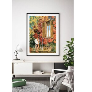May include: A framed art print showing a collage of a person gazing out of a window. The window reveals an autumnal landscape with trees and deer. The person is dressed in a red and white shirt and white shorts. The print is in a black frame.