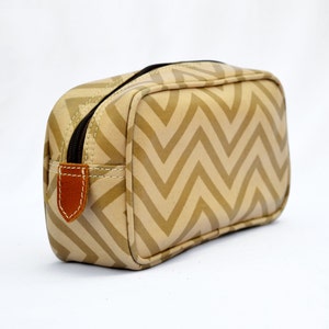 Beige toiletry bag, chevron print, laminated bag, leather trims,  make up or cosmetic bag, utility pouch.