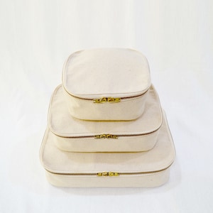 Set of 3 nesting boxes, cotton, zip closure.