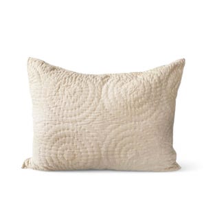 May include: A cream-coloured quilted pillow with a subtle pattern. The pillow is made of a soft, natural fabric and has a relaxed, comfortable look.