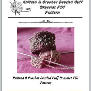May include: A PDF pattern for a knitted and crocheted beaded cuff bracelet. The image shows a close-up of the bracelet, which is made with a pink yarn and silver beads. The bracelet is lying on a pink fabric surface.