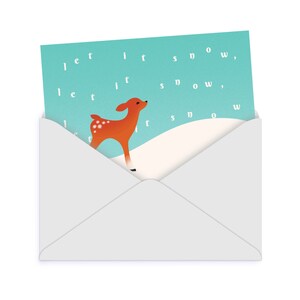 May include: A light blue card with the text "let it snow" repeated three times. A small, brown deer with white spots stands on a white snowy hill. The card is in a white envelope.
