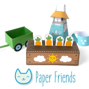 May include: A paper craft kit featuring a bunny farmer with a watering can, a green wagon, and a brown planter box with four carrots. The planter box has a smiling sun and clouds. The text "Paper Friends" is at the bottom of the image.