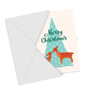 May include: A Christmas card with a green and white snowflake pattern. The card features two deer kissing in front of a stylized Christmas tree. The text "Merry Christmas" is written in green cursive.