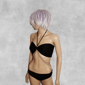 May include: A black bikini top with a chain detail and a matching black bikini bottom.