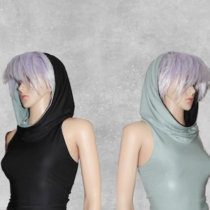 May include: Two sleeveless tops with a cowl neck and a hood. The top on the left is black with a light blue hood lining. The top on the right is light blue with a black hood lining.