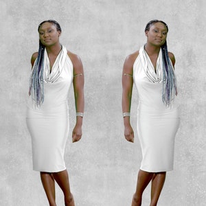 May include: Two people wearing white halter dresses with long blue braids. The dresses have a cowl neck and are fitted to the body.