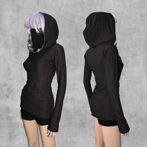May include: Black long-sleeved hooded top with a high neckline and a fitted silhouette. The top is made of a soft, stretchy fabric and has a relaxed fit.