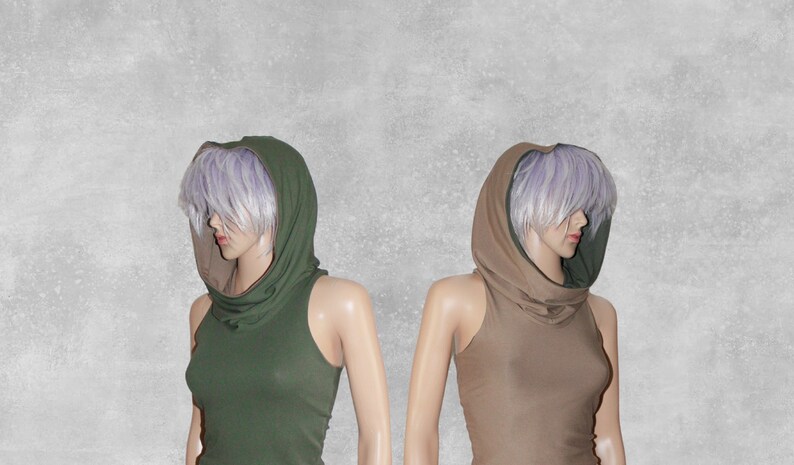 May include: Two sleeveless tops with a cowl neck and a hood. One top is olive green and the other is beige.