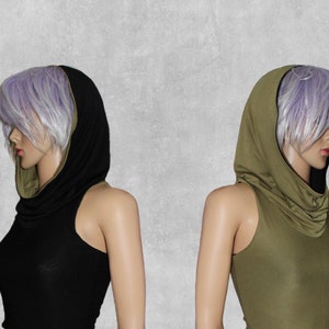May include: Two sleeveless tops with a cowl neck and a hood. The top on the left is black with a green trim. The top on the right is green with a black trim.