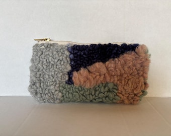 Pouch needle pouch with metal zipper pull and a canvas lining