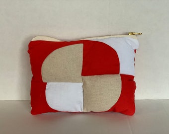 Puffy pouch with modern geometric shapes