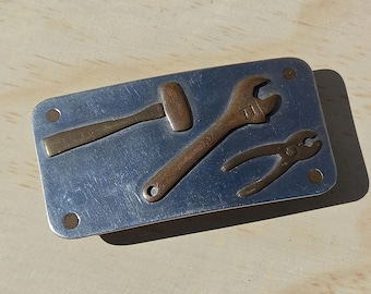 Vintage handyman belt buckle with brass tools