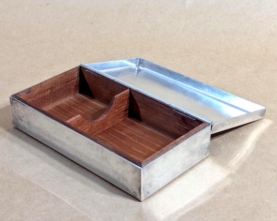 Sliver-plated cigarette case dated 1960