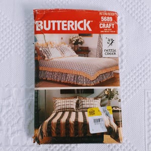 May include: A vintage sewing pattern from Butterick, pattern number 5689, for a Craft project. The pattern is for a bed skirt with a ruffled edge. The pattern is called Nettle Creek.