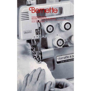 May include: A white Bernette 3 overlock sewing machine with a gray electronic control panel and a white fabric being sewn. The machine has a label that reads "Bernette 3 Made for Bernina".