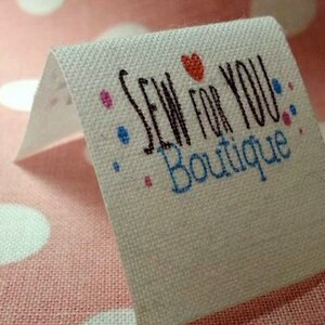 40 fabric folded labels 1"x 1"  heat sealed edges no fraying  personalized with your logo doll clothes,pocket books, clothing