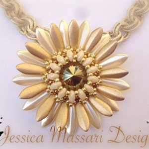 May include: A gold and cream beaded flower pendant necklace with a crystal centre. The necklace is made with a beige cord.