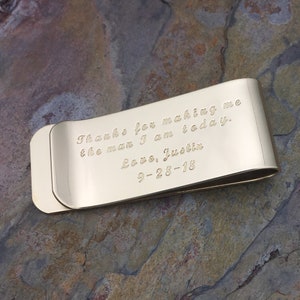 May include: Gold-toned metal money clip with an engraved message: "Thanks for making me the man I am today. Love, Justin 9-28-18"