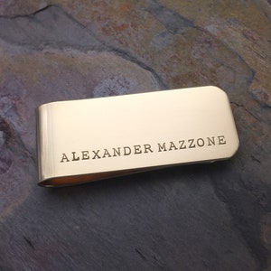 Gold brass metal money clip with personalized text, initials or monogram.